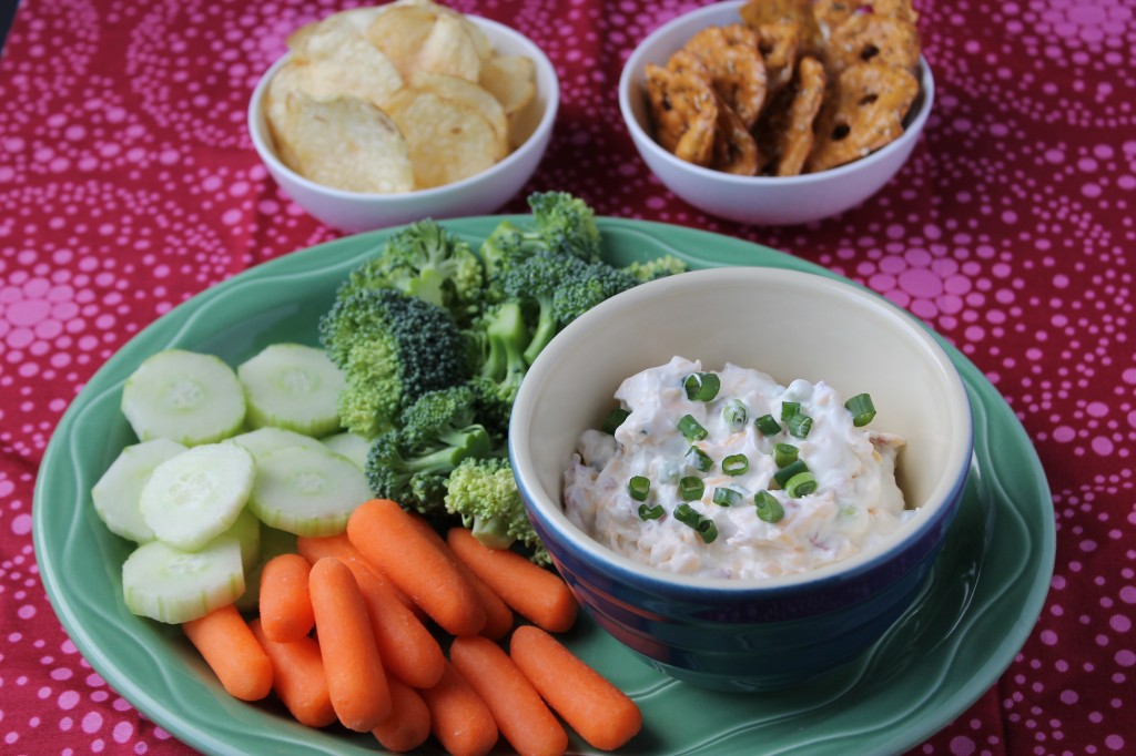 Baked Potato Dip with veggies, chips, and pretzels