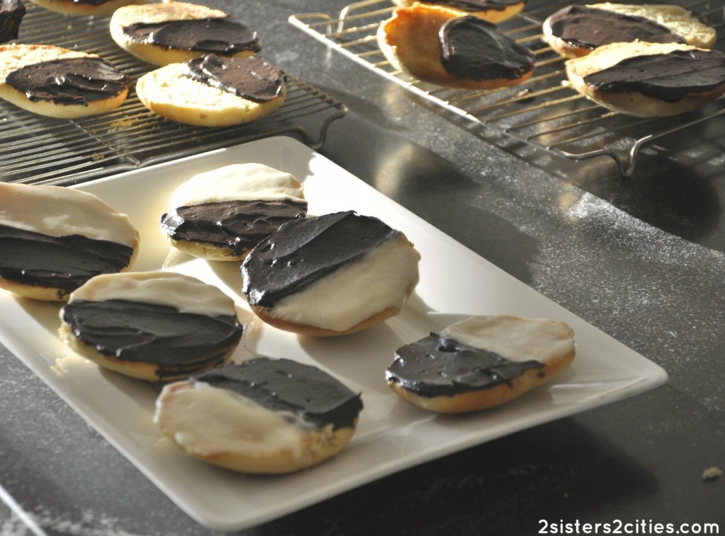 half moon cookies on a cooling rack and plate